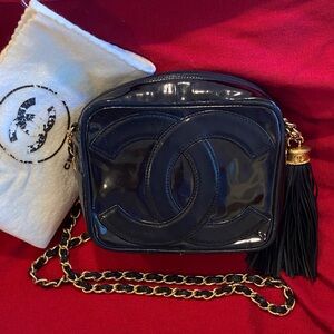 CHANEL Black Patent Leather Crossbody Camera Bag with Gold Chain and Tassel